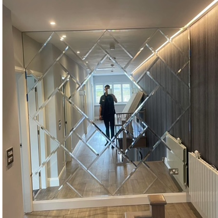 Diamond pattern mirror feature wall Manchester hallway