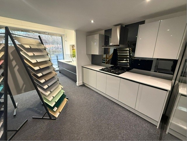 Kitchen glass splashback display with socket cutouts